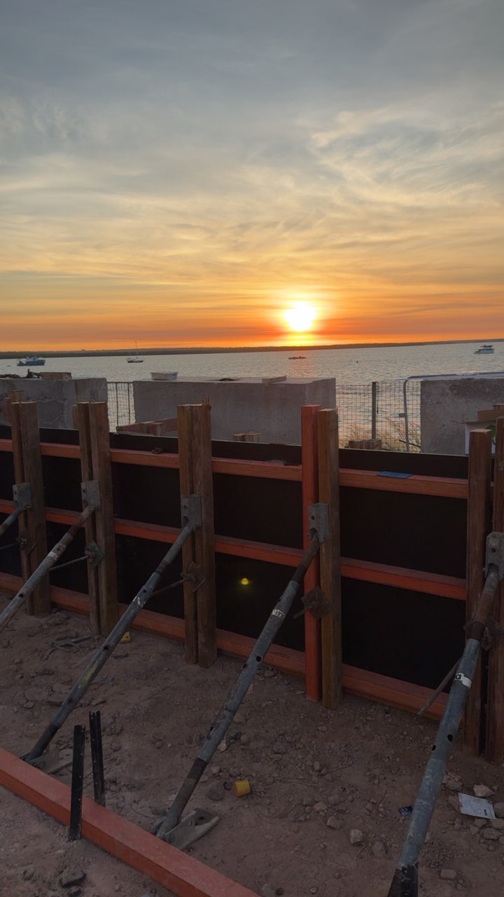 Formwork set up on a waterfront job at sunset