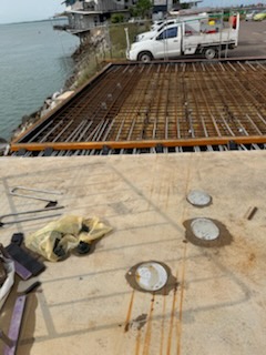 Steel reinforcement and formwork on a waterfront slab